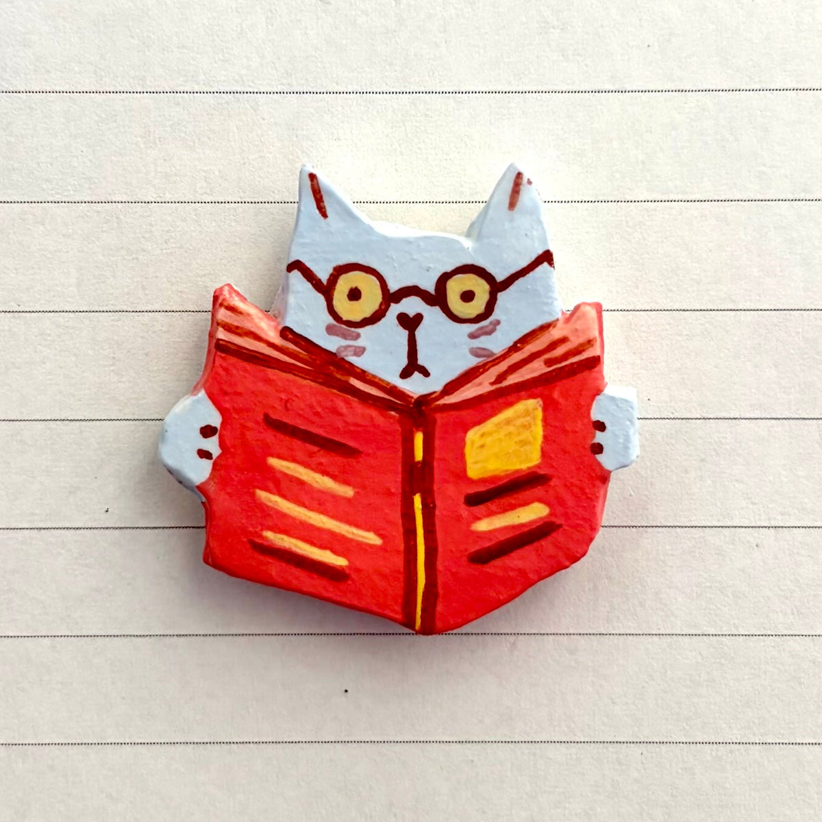 OFF THE WALL - reading cat
