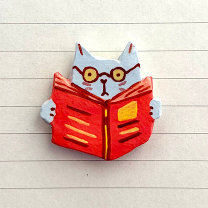 OFF THE WALL - reading cat