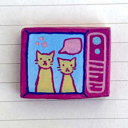 OFF THE WALL - cat on tv